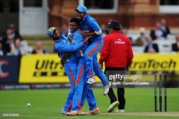 Ravichandran Ashwin of India celebrates with team mates after catching Ben Stokes of England off his own bowling during the 4th Natwest One Day...