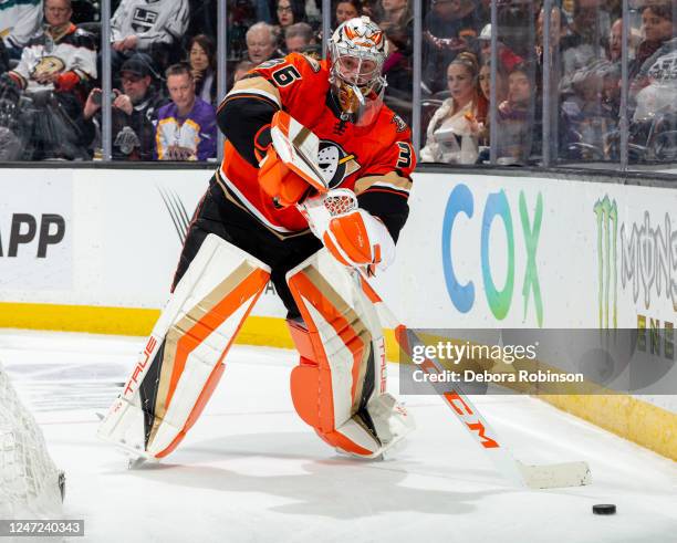 Goaltender John Gibson of the Anaheim Ducks clears the pic during the second period of the game against the Los Angeles Kings at Honda Center on...