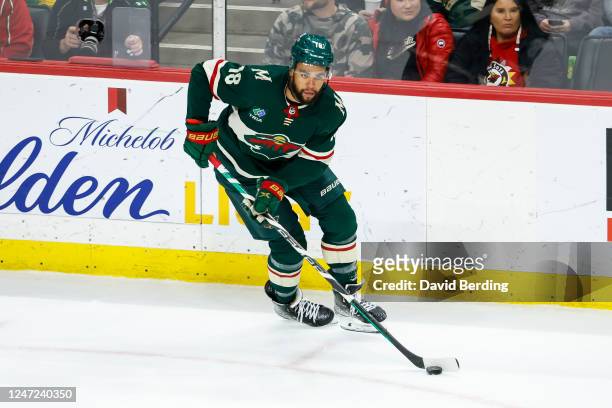 Jordan Greenway of the Minnesota Wild skates with the puck against the Dallas Stars in the third period of the game at Xcel Energy Center on February...
