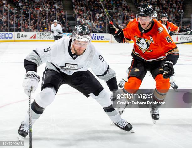 Adrian Kempe of the Los Angeles Kings and Cam Fowler of the Anaheim Ducks race for the puck during the second period of the game at Honda Center on...
