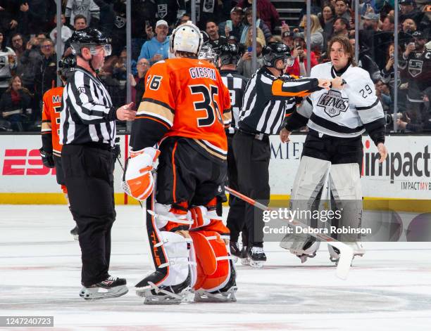 Goaltender Pheonix Copley of the Los Angeles Kings and goaltender John Gibson of the Anaheim Ducks exchange words as Copley leaves the ice after a...