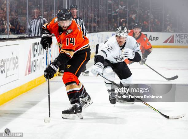 Adam Henrique of the Anaheim Ducks and Kevin Fiala of the Los Angeles Kings race for the puck at Honda Center on February 17, 2023 in Anaheim,...