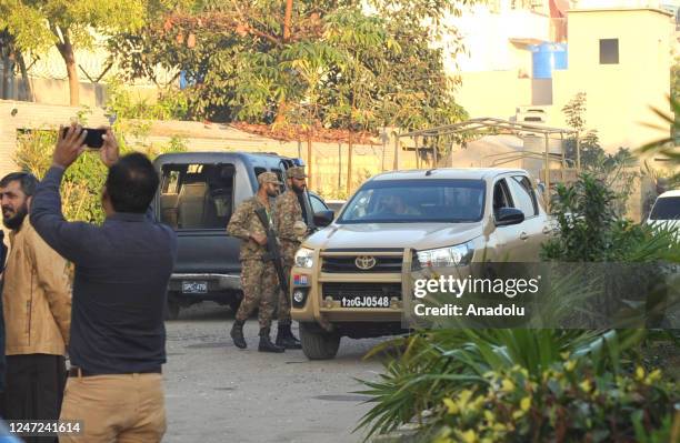 Paramilitary soldiers take measures outside a police headquarters in Karachi, Pakistan on February 18, 2023. A group of armed assailants stormed the...