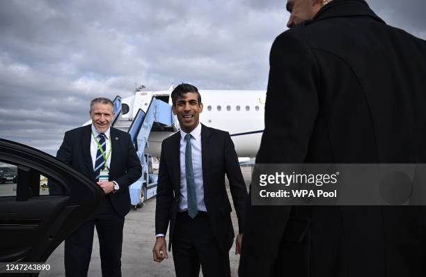 Britain's Prime Minister Rishi Sunak smiles after arriving at the airport, ahead of attending the Munich Security Conference , on February 18, 2023...