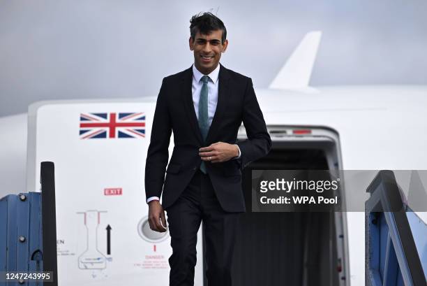 Britain's Prime Minister Rishi Sunak disembarks his plane after arriving at the airport, ahead of attending the Munich Security Conference , on...