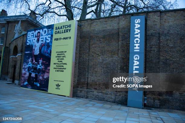 Advertisement signs seen outside the exhibition. From defiant train writers to powerful large-scale muralists. Over 100 international artists are...