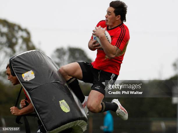 Zac Guildford of the All Blacks leaps onto Israel Dagg during a New Zealand All Blacks IRB Rugby World Cup 2011 training session at Beetham Park on...