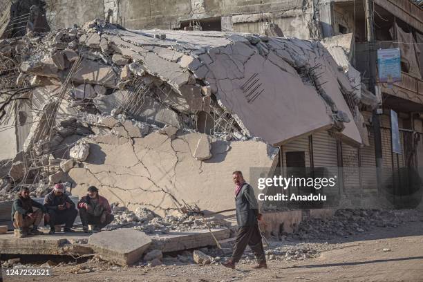 View of collapsed buildings as Syrians continue their lives in harsh conditions in quake hit Jindires district of Aleppo, Syria after 7.7 and 7.6...