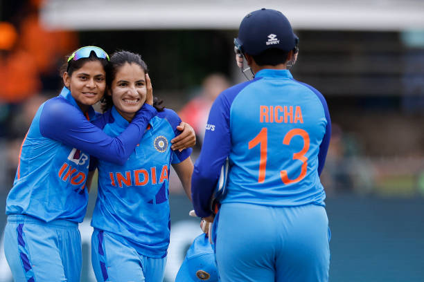 India's Renuka Singh Thakur is congratulated by teammates after taking 5 wickets in the innings during the Group B T20 women's World Cup cricket...
