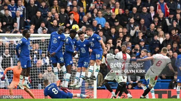 Southampton's English midfielder James Ward-Prowse scores the opening goal from this freekick during the English Premier League football match...