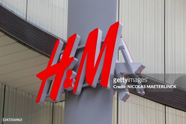 The logo of Hennes and Mauritz shop in the Nieuwstraat/ Rue Neuve shopping street in Brussels on February 18, 2023. - Belgium OUT / Belgium OUT