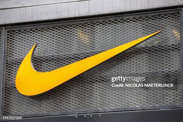 Illustration picture shows the logo of Nike brand in the Nike shop in the Nieuwstraat/ Rue Neuve shopping street in Brussels, Saturday 18 February...