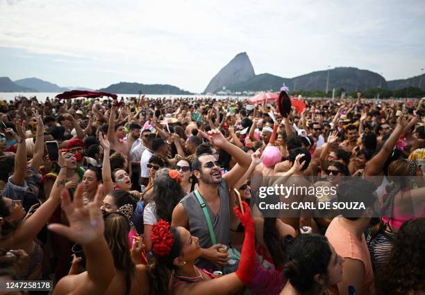 Revellers take part in a street party called Amigos Da Onca close to Flamengo beach in Rio de Janeiro, Brazil, on February 18, 2023. - Carnival has...