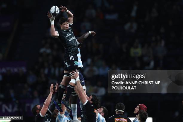 Brive's South African flanker Retief Marais jumps to catch the ball during the French Top14 rugby union match between Racing92 and Club Athletique...