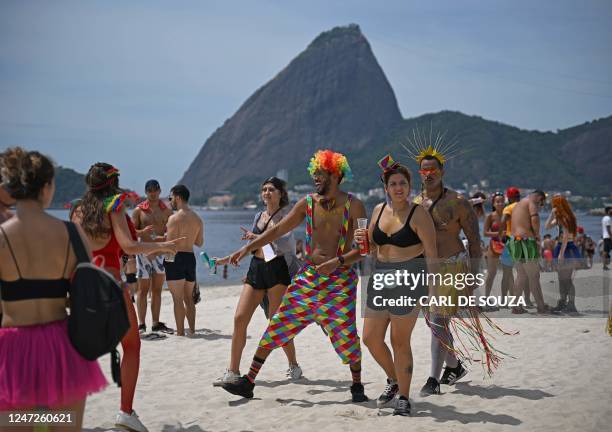 Graphic content / Revellers are seen in front of Sugarloaf mountain during a street party called Amigos Da Onca in Rio de Janeiro, Brazil, on...