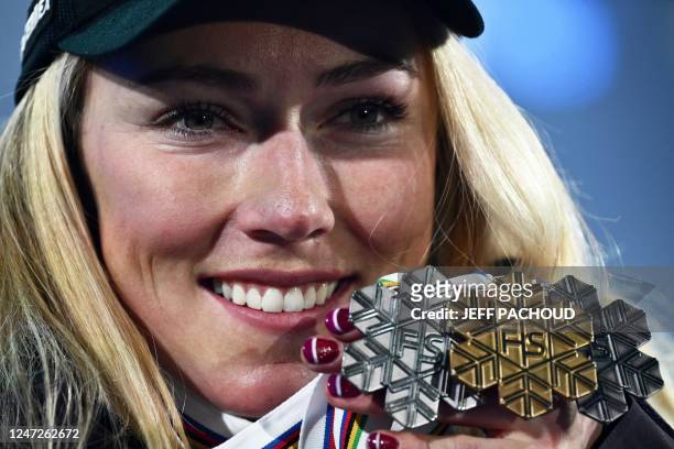 Silver medalist US Mikaela Shiffrin celebrates with her medals during the award ceremony of the Women's Slalom event of the FIS Alpine Ski World...