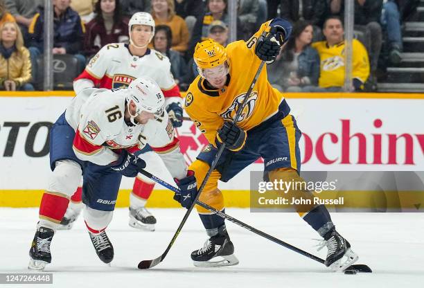 Aleksander Barkov of the Florida Panthers battles for the puck against Ryan Johansen of the Nashville Predators during an NHL game at Bridgestone...