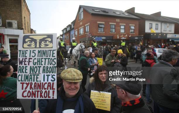 Protesters gather in Broad Street to demonstrate against 15-minute cities and listen to speeches on February 18, 2023 in Oxford, England. The concept...