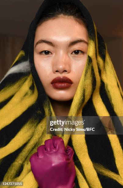 Model prepares backstage ahead of the Roksanda show during London Fashion Week February 2023 on February 18, 2023 in London, England.