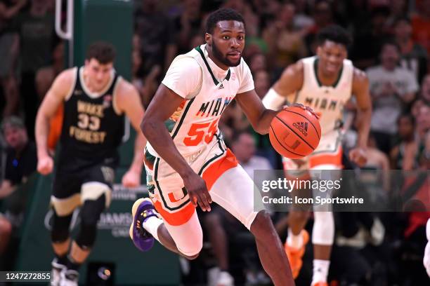 Miami guard Wooga Poplar breaks for the basket, followed by forward Anthony Walker and Wake Forest forward/center Matthew Marsh , after recovering a...