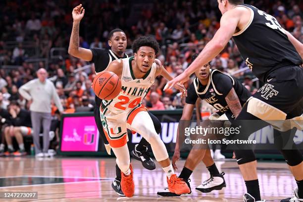 Miami guard Nijel Pack attempts to make his way through the Wake Forest defense in the first half as the Miami Hurricanes faced the Wake Forest Demon...