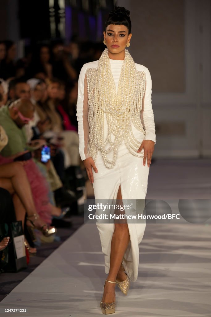 A model walks the runway at the Atelier Zuhra show during London