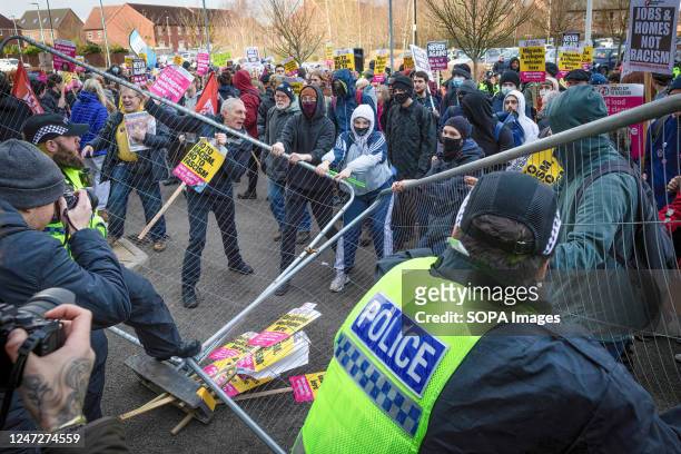Counter protesters clash with police during the England For The English protest outside the Holiday Inn hotel which is housing refugees. An...