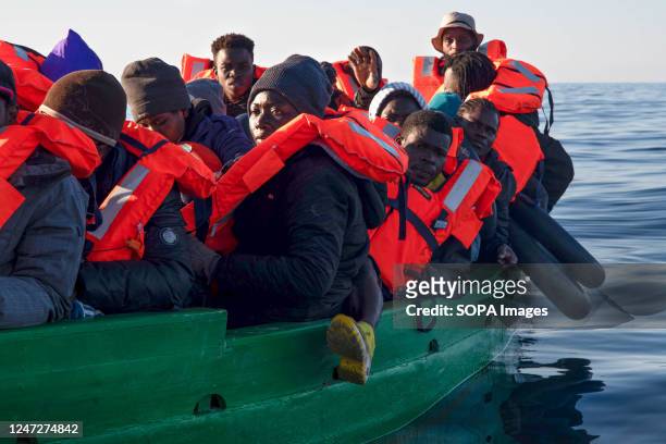 Group of 31 migrants from Ivory Coast, Senegal and Guinea Conakry are given life jackets and await directions from the Aita Mari boat rescue team to...