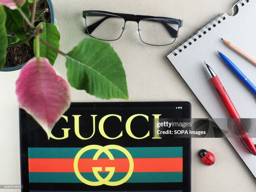 In this photo illustration, a Guccio Gucci, . logo seen... News Photo - Getty Images In this photo illustration, a Guccio Gucci, . logo seen... News Photo - Getty Images