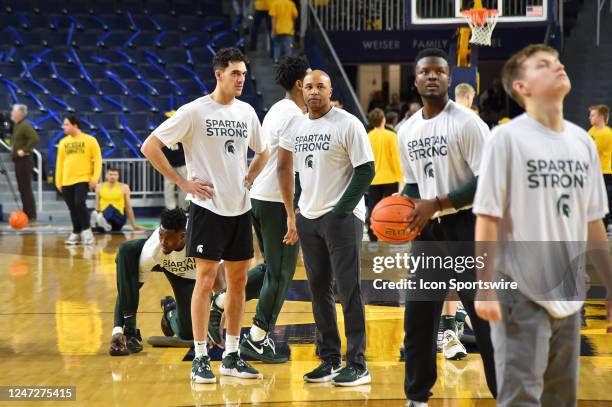 Michigan State Spartans team and support staff wear Spartan Strong shirts during pregame warmups prior to the Michigan Wolverines versus the Michigan...