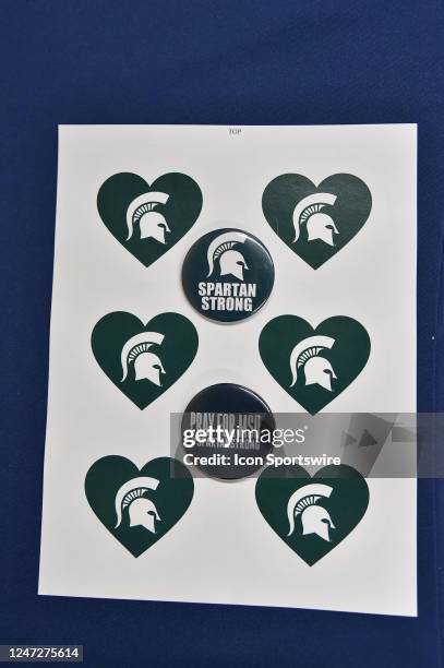 Sheet of stickers and buttons that were given out to support Spartan Strong during the Michigan Wolverines versus the Michigan State Spartans game on...