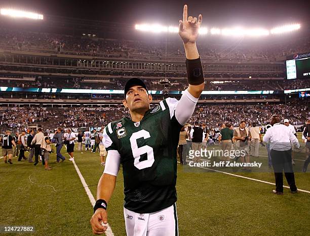 Mark Sanchez of the New York Jets celebrates after the Jets won 27-24 against the Dallas Cowboys during their NFL Season Opening Game at MetLife...