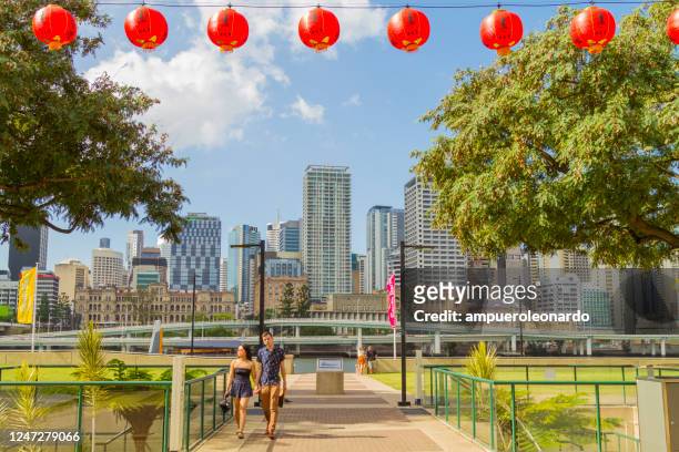 chinese lantern and wheel of brisbane ferris wheel on brisbane's southbank, queensland, australia - brisbane festival stock pictures, royalty-free photos & images