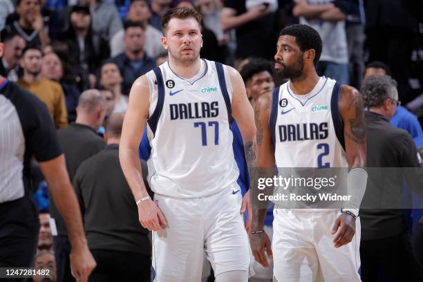 Luka Doncic and Kyrie Irving of the Dallas Mavericks look on during the game against the Sacramento Kings on February 11, 2023 at Golden 1 Center in...