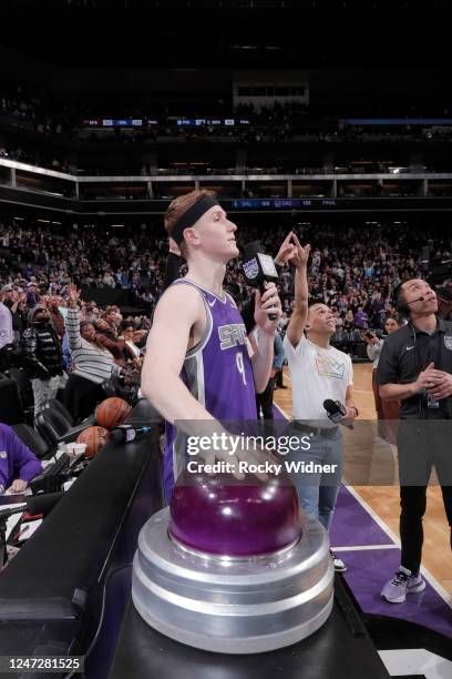 Kevin Huerter of the Sacramento Kings lights the purple victory beam after defeating the Dallas Mavericks on February 11, 2023 at Golden 1 Center in...