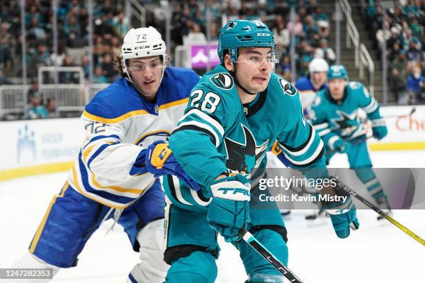 Timo Meier of the San Jose Sharks skates after the puck against Tage Thompson of the Buffalo Sabres at SAP Center on February 18, 2023 in San Jose,...