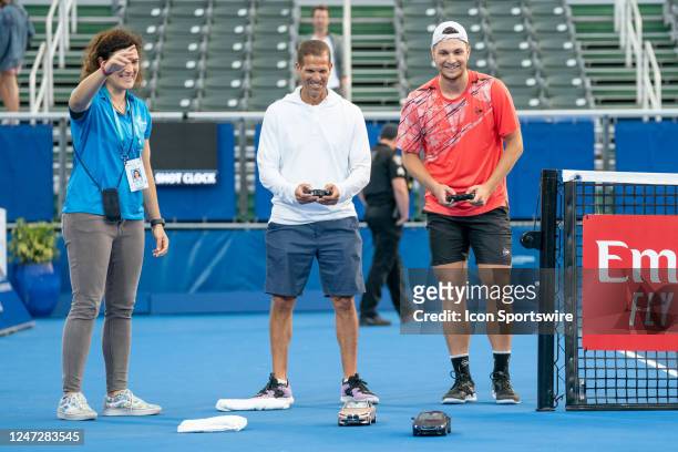 Miomir Kecmanovic races remote control cars after winning the Semifinals round of the ATP Delray Beach Open on February 18 at the Delray Beach...