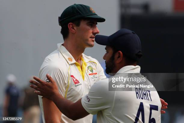 Pat Cummins of Australia interacts with the Rohit Sharma of India after the match during day three of the Second Test match in the series between...