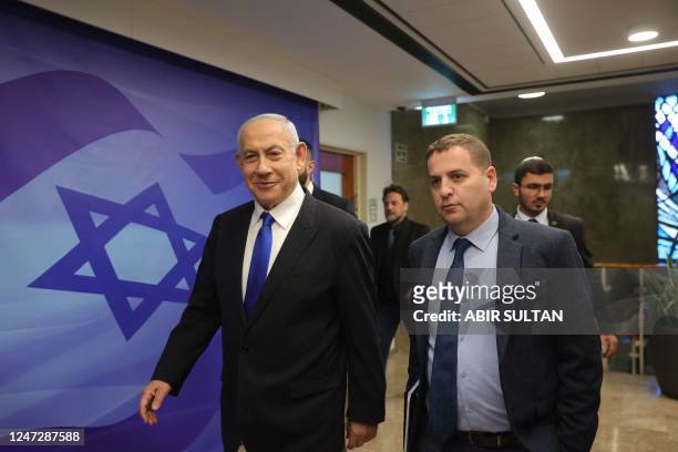Israeli Prime Minister Benjamin Netanyahu arrives to his office in Jerusalem to attend the weekly cabinet meeting, on February 19, 2023.