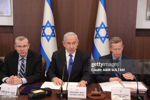 Israeli Prime Minister Benjamin Netanyahu , Justice Minister Yariv Levin and cabinet secretary Yossi Fuchs, attend the weekly cabinet meeting in the...