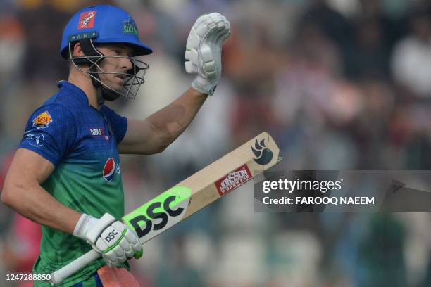 Multan Sultans' David Miller celebrates his half century during the Pakistan Super League Twenty20 cricket match between Multan Sultans and Islamabad...