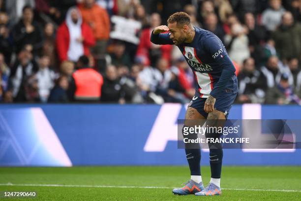 Paris Saint-Germain's Brazilian forward Neymar celebrates scoring his team's second goal during the French L1 football match between Paris...