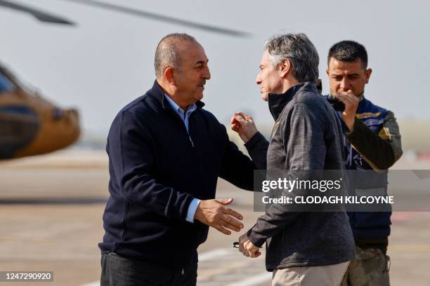 Secretary of State Antony Blinken is welcomed by Turkish Foreign Minister Mevlut Cavusoglu as he arrives at Incirlik Air Base near Adana on February...