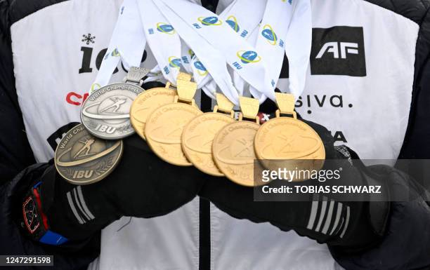 Norway's Johannes Thingnes Boe presents all the medals he won during the IBU Biathlon World Championships in Oberhof, eastern Germany, after the...