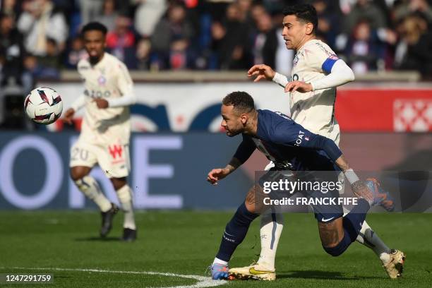 Paris Saint-Germain's Brazilian forward Neymar is injured after a contact with Lille's French midfielder Benjamin Andre during the French L1 football...