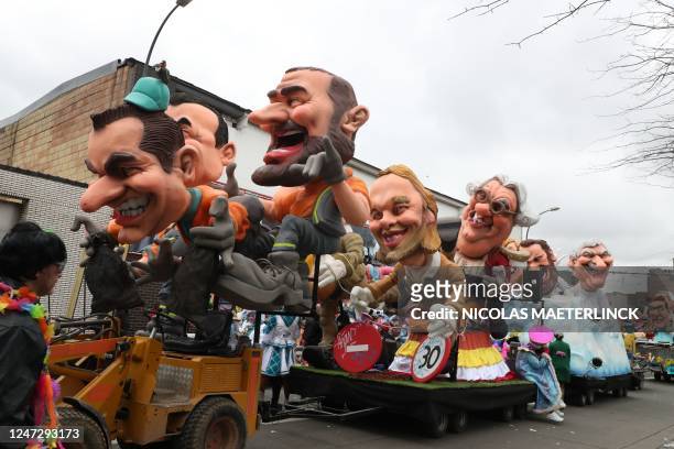 People enjoy the Zondagstoet of the 93rd edition of the annual three-day Aalst carnival, in Aalst, eastern Flanders on February 19 as celebrations...