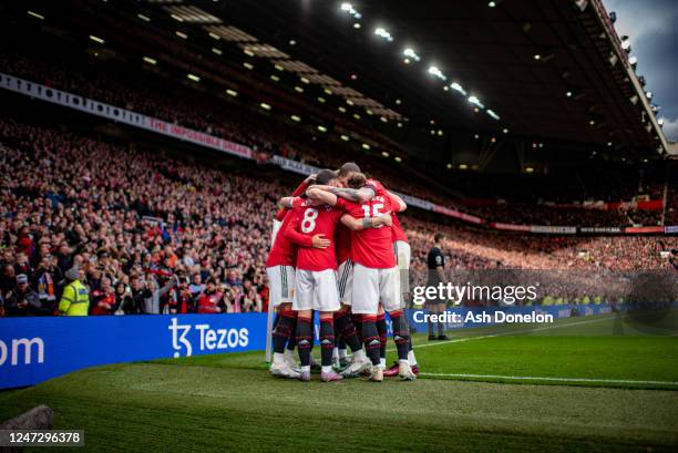 Jadon Sancho of Manchester United celebrates scoring a goal to make the score 3-0 with his team-mates during the Premier League match between...