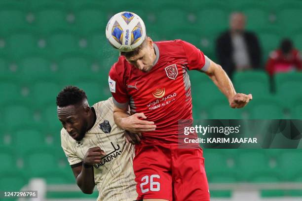 Duhail's defender Federico Fernandez and Rayyan's forward Yohan Boli vie for a header during the AFC Champions League round of 16 match between...