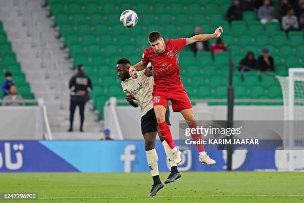 Duhail's defender Federico Fernandez and Rayyan's forward Yohan Boli vie for a header during the AFC Champions League round of 16 match between...