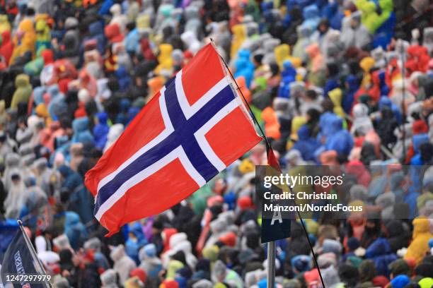 Norwegian flag waves in the wind on the grandstand during the Mens 15 km Mass Start at the IBU World Championships Biathlon Oberhof on February 19,...